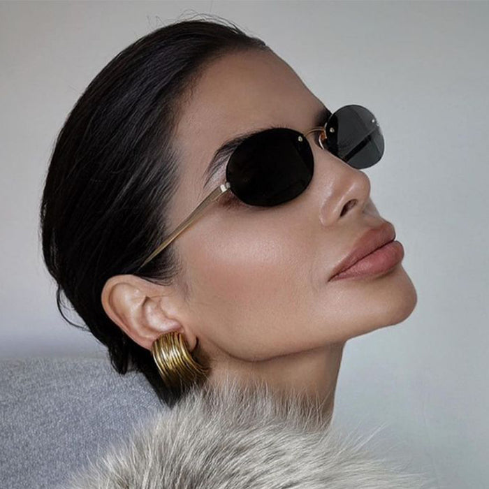 Wholesale Frameless metal oval sunglasses, fashionable and personalized small frame sunglasses