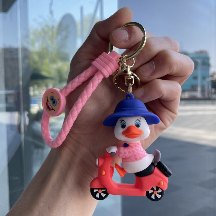 Wholesale Tram couple duck keychain couple backpack pendant claw machine doll car keychain exquisite small gift wholesale