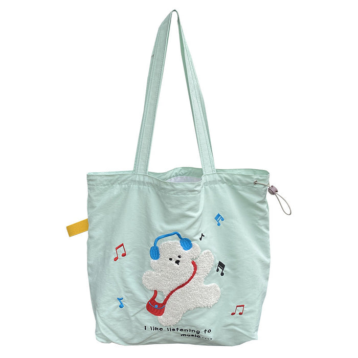 Wholesale Niche cartoon embroidered shoulder bag, simple and large capacity drawstring canvas bag, commuting tote bag for work