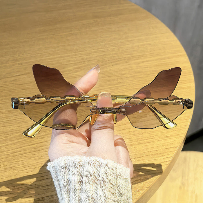 Wholesale Dragonfly shaped frameless sunglasses, personalized, penetrating, funny, decorative sunglasses