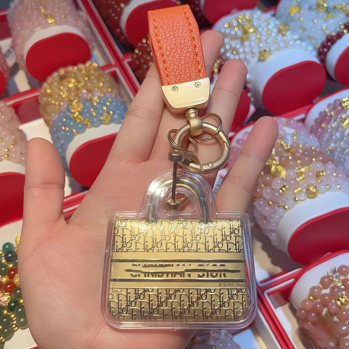 Wholesale Cute gold-colored bag keychain