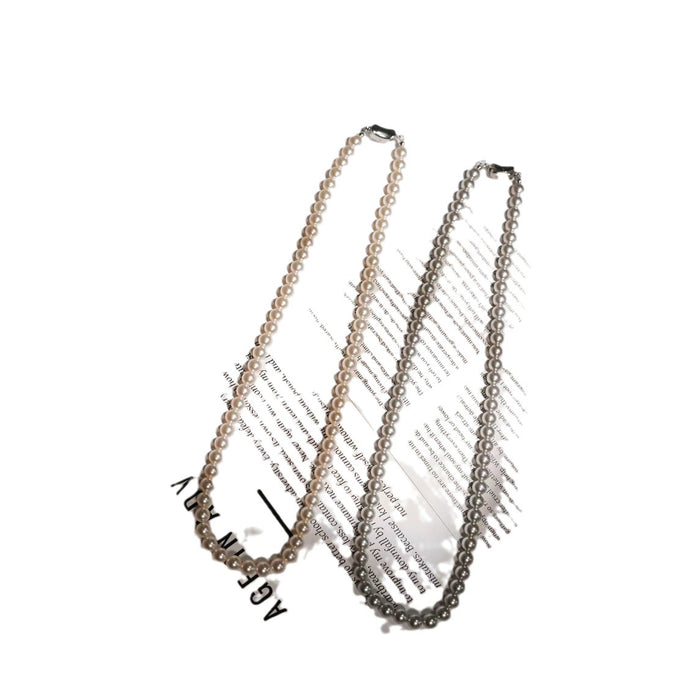 Wholesale Pearl titanium steel necklace, women's round, light luxury temperament, versatile autumn and winter sweater chain