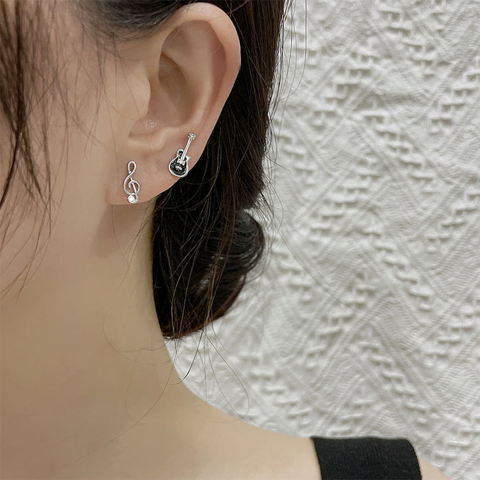 Wholesale Creative Cute Note Earrings Black Compact Single Diamond Asymmetric Violin Instrument Earrings