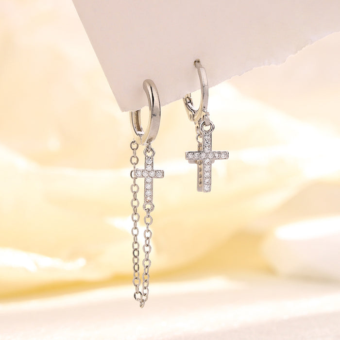 Wholesale Double layered cross studded diamond earrings with neutral tassels and asymmetrical cross shaped ear loops