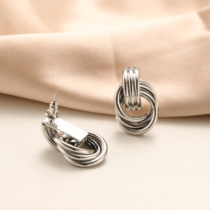 Wholesale Exaggerated double knot earrings, personalized copper plated earrings, niche high-end, light luxury temperament earrings