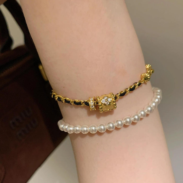 Wholesale Light luxury black gold woven bracelet, women's personality, versatile bracelet, unique and niche design, handmade accessory