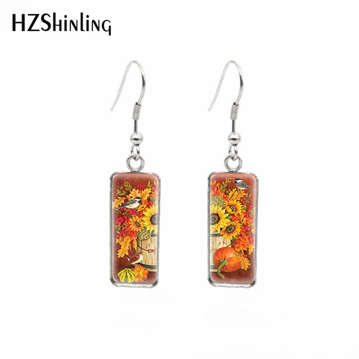 Wholesale Independently packaged hook flower pendant earrings, creative time gemstone earrings