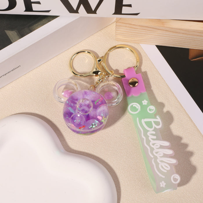 Wholesale quicksand bottle keychain wholesale floating liquid crystal key chain school bag pendant car keychain