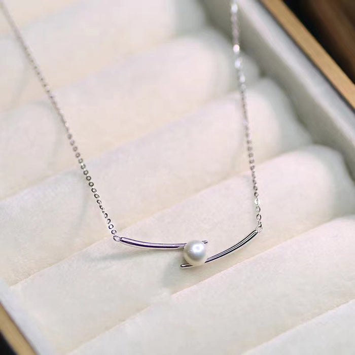 Wholesale Cross pearl necklace, titanium steel, light luxury, niche design, collarbone chain, high-end sensory chain