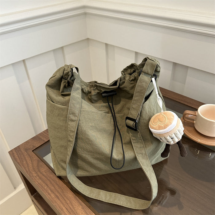 Wholesale Niche casual artistic canvas bucket bag, fashionable drawstring single shoulder pleated nylon crossbody bag