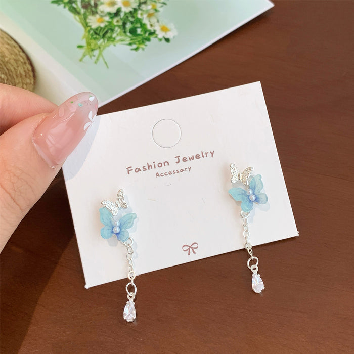 Wholesale Resin pearl butterfly earrings with tassels and silver needles, sweet temperament, light luxury, high-end feel, versatile earrings