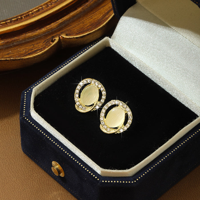 Wholesale Round cat eye stone earrings, simple and gentle sparkling diamond earrings, retro temperament, daily earrings