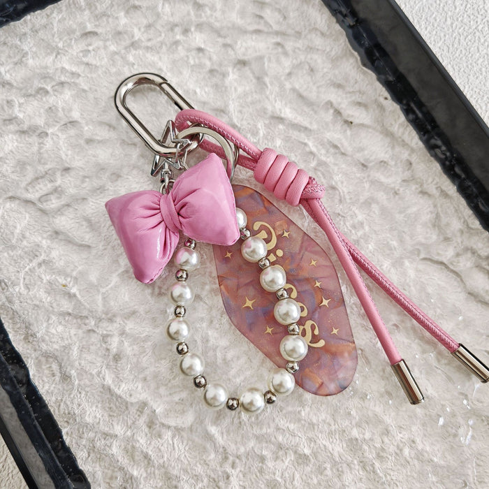 Wholesale Simple Bow Woven Leather Rope Pearl Chain Hanging Keychain