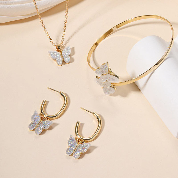 Wholesale Versatile alloy butterfly earrings, bracelets, necklaces, four piece jewelry pendant set