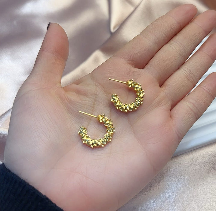 Wholesale Gold colored plain ring earrings, elegant earrings, studs, niche design, high-end ear rings, and earrings