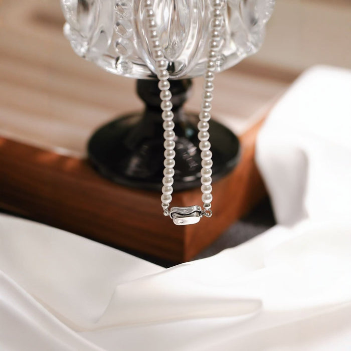 Wholesale Pearl titanium steel necklace, women's round, light luxury temperament, versatile autumn and winter sweater chain