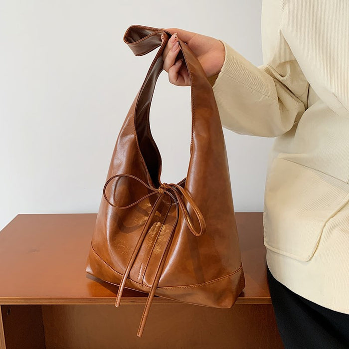 Wholesale Small commuting bag, versatile leisure bag, bow tie, large capacity single shoulder underarm tote bag