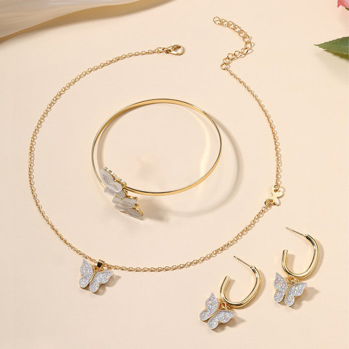 Wholesale Versatile alloy butterfly earrings, bracelets, necklaces, four piece jewelry pendant set