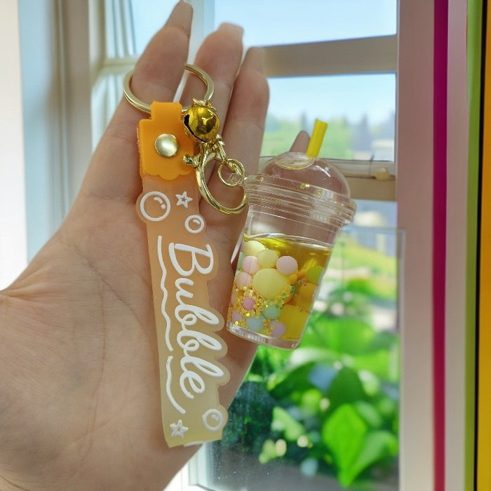 Wholesale Acrylic oil bottle candy Bean astronaut keychain