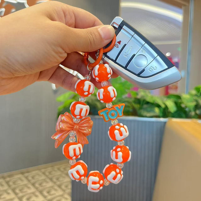 Wholesale Handmade bead painted bow, mobile phone chain pendant, letter bag pendant, hanging decoration