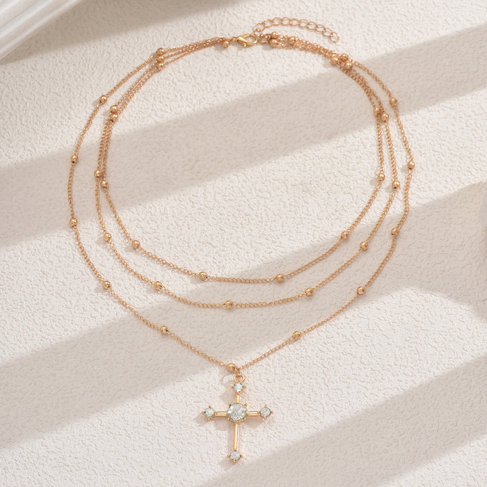Wholesale Fashionable, minimalist, niche temperament cross necklace with multiple layers of diamonds and gold beads
