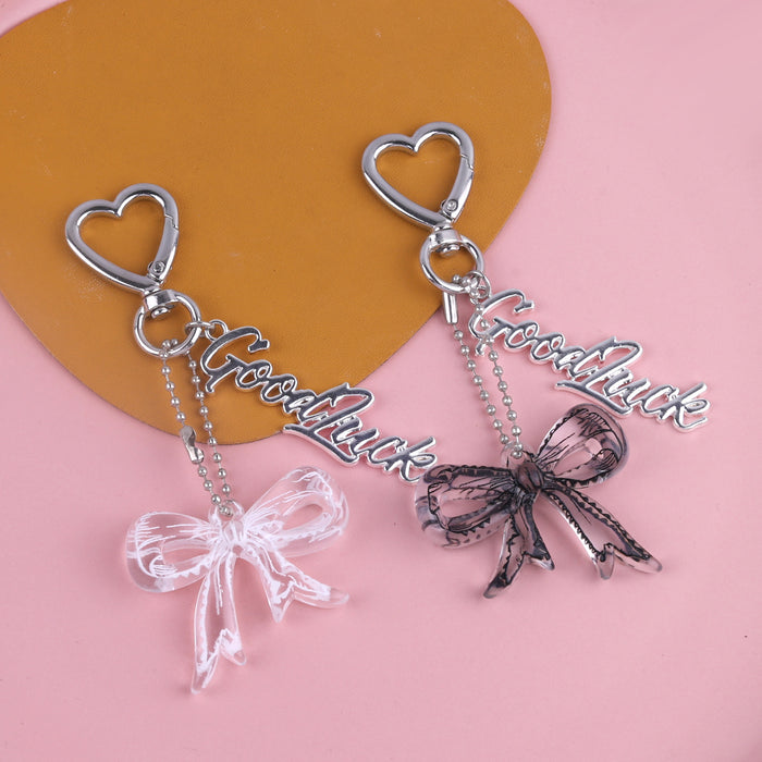 Wholesale Trendy black and white transparent bow acrylic heart keychain bag pendant personalized letter creative accessories