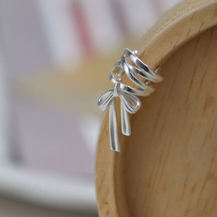 Wholesale Ballet bow ear bone clip niche design matte metal personality simple and versatile temperament earrings without ear holes