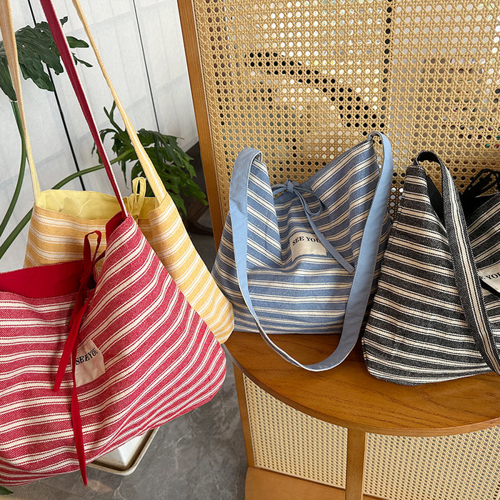 Wholesale Canvas striped large capacity fashionable simple versatile crossbody bag for work commuting tote bag