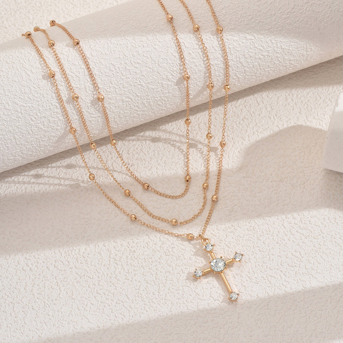 Wholesale Fashionable, minimalist, niche temperament cross necklace with multiple layers of diamonds and gold beads