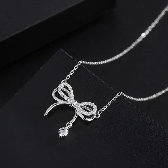 Wholesale Double layered bow necklace with niche design and versatile water droplet tassel collarbone chain pendant