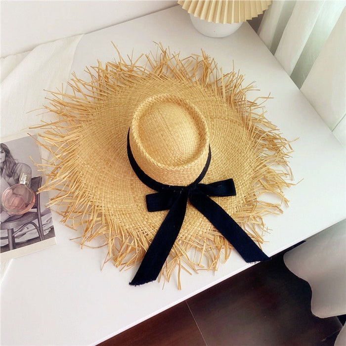 Wholesale Big brim frayed Lafite grass hat women's beach hat for beach vacation, sun protection and sunshade hat