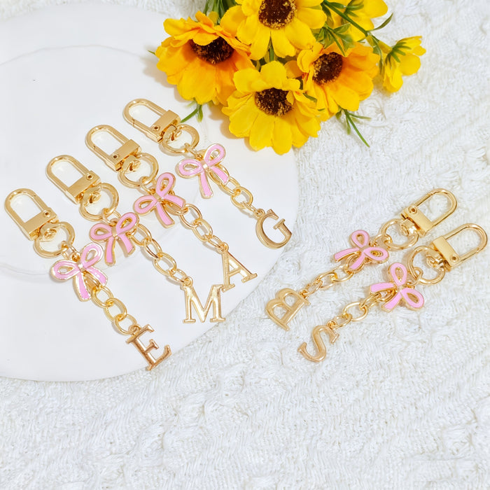 Wholesale Pink bow A-Z keychain alloy accessory