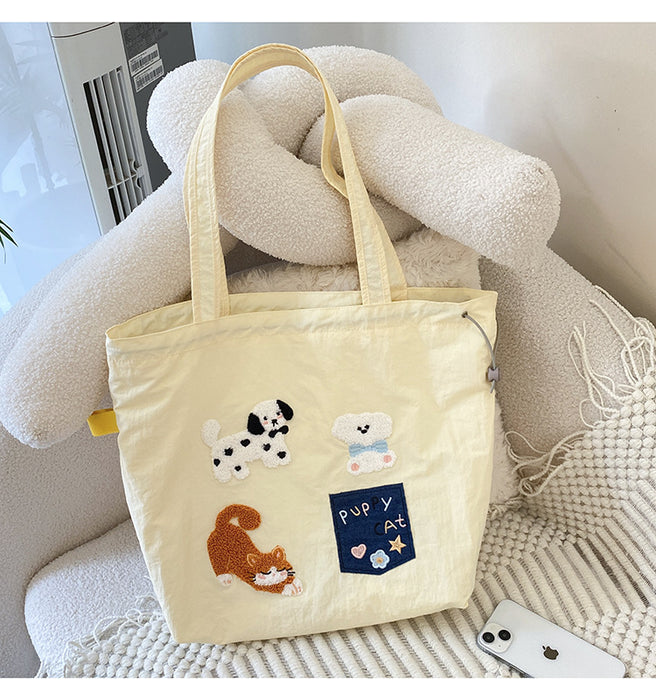 Wholesale New cute cartoon embroidered drawstring shoulder bag, fashionable and simple canvas bag, large capacity tote bag
