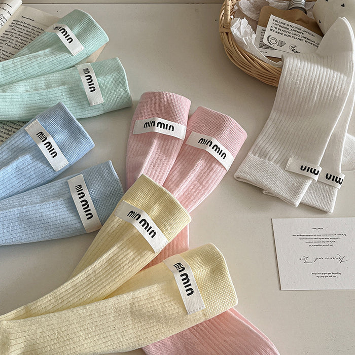 Wholesale Sock fabric label letter pile socks college style versatile colorful mid tube socks