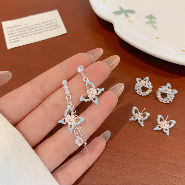 Wholesale Sweet and exquisite butterfly cherry blossom pearl earrings with silver needles, niche design, high-end and versatile earrings