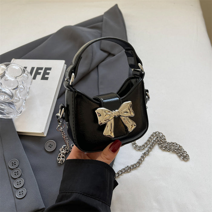 Wholesale New retro oil leather handbag with shiny bow and chain crossbody bag