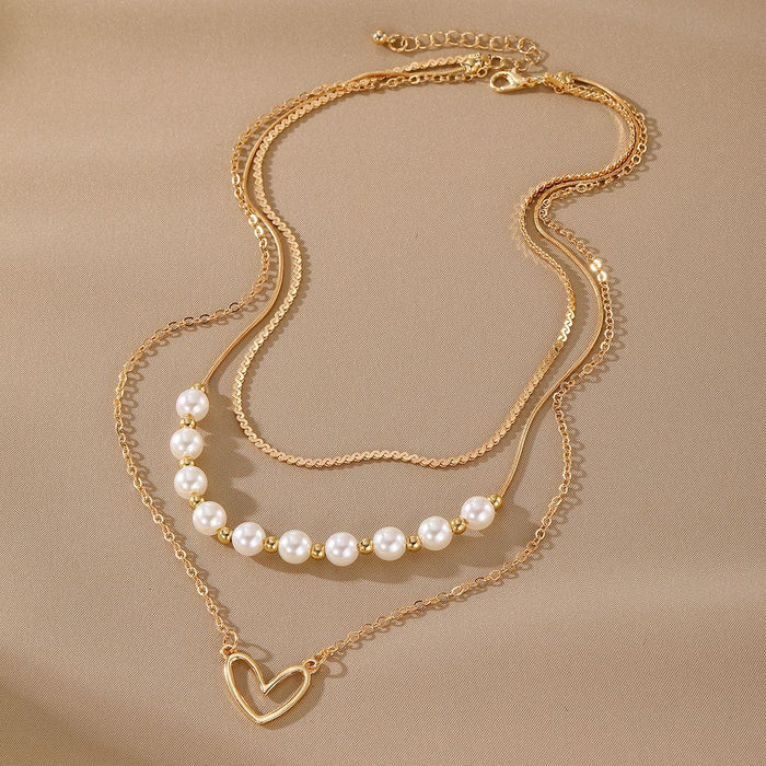 Wholesale Fashionable imitation pearl heart-shaped hollow pendant necklace, exquisite, high-end, versatile, multi-layer stacked collarbone chain