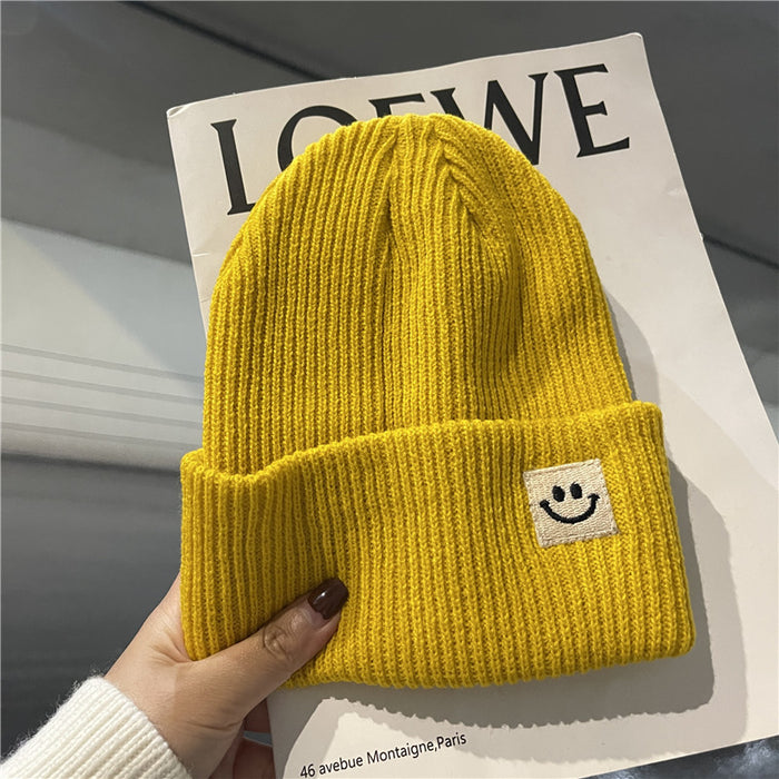 Wholesale Autumn and Winter Cute Smiley Face Logo Wool Knitted Hat JDC-FH-Yizhan002