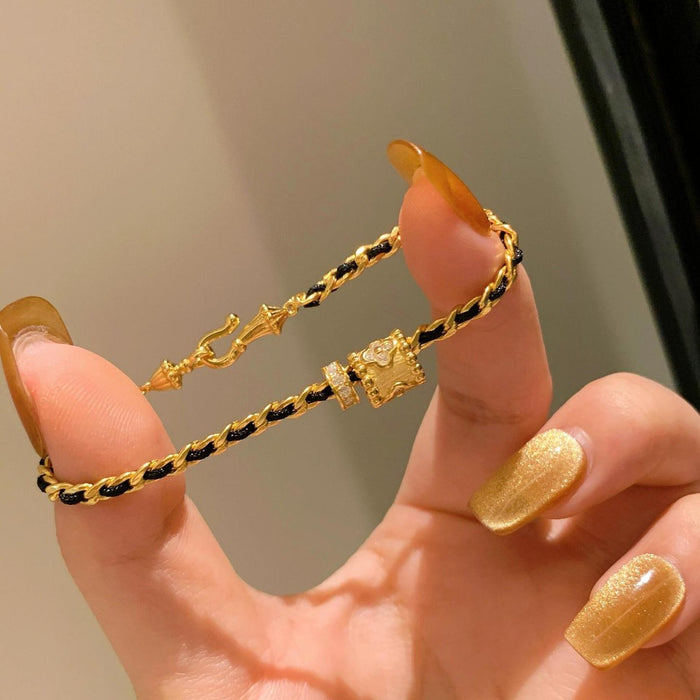 Wholesale Light luxury black gold woven bracelet, women's personality, versatile bracelet, unique and niche design, handmade accessory