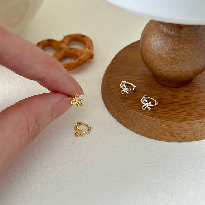 Wholesale Pure silver bow earrings with simple, compact, exquisite and niche design, high-end, natural and versatile new earrings