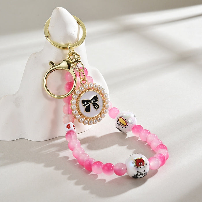 Wholesale Glass bead round brand bow keychain