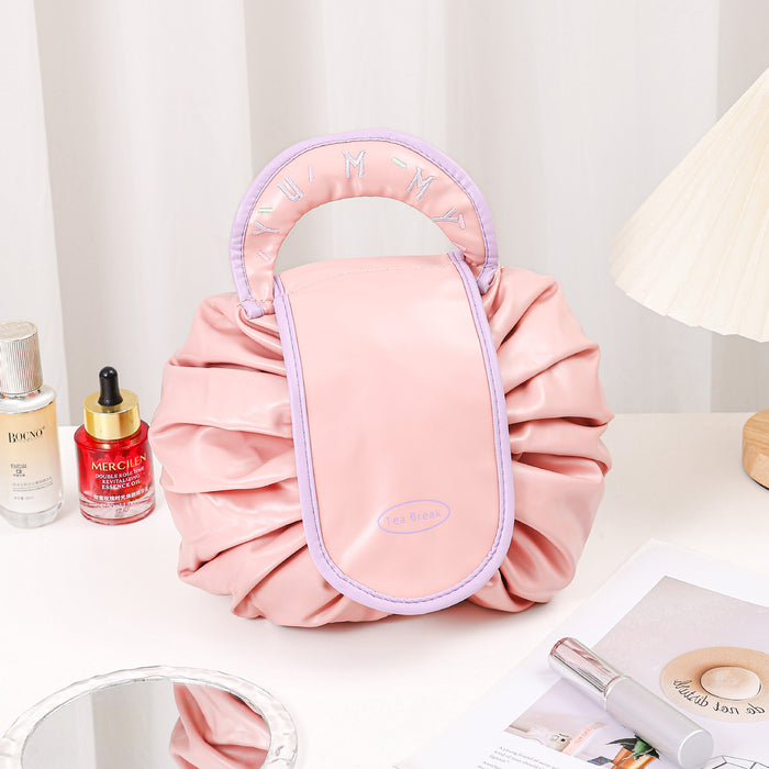 Wholesale PU Pink Cylindrical Cosmetic Bag Light Luxury Drawstring Travel Makeup Pouch For Women
