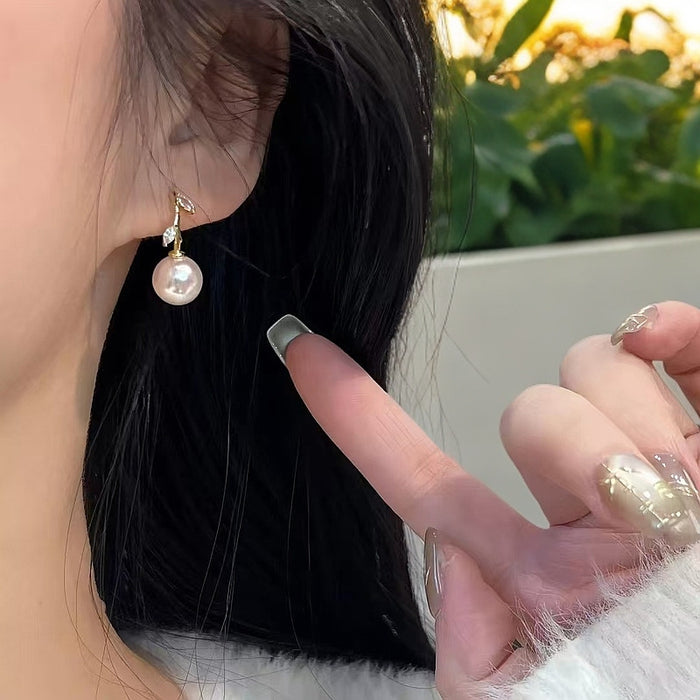 Wholesale A pair of cross leaf pearl earrings with light luxury temperament, fashionable and versatile ear accessories