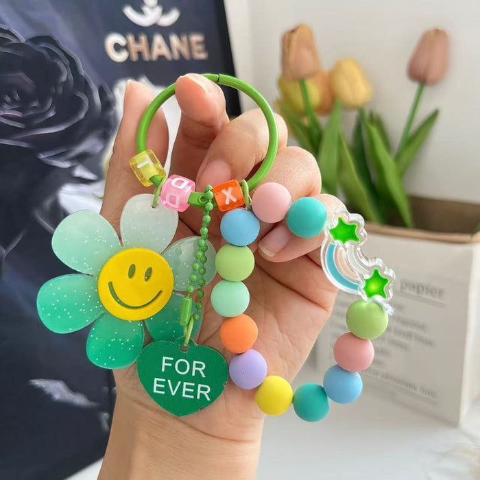 Wholesale Cute letter sunflower bag pendant with smiling face, colorful handmade bead key chain
