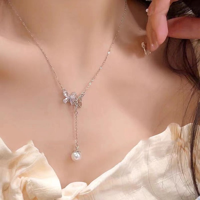 Wholesale Titanium steel micro inlaid jewelry hollow butterfly collarbone chain pearl tassel pendant light luxury accessory