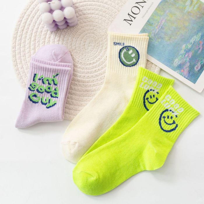 Wholesale of 10pcs Solid Color Knitted Smiling Face Mid Length Socks JDC-SK-Miqi007