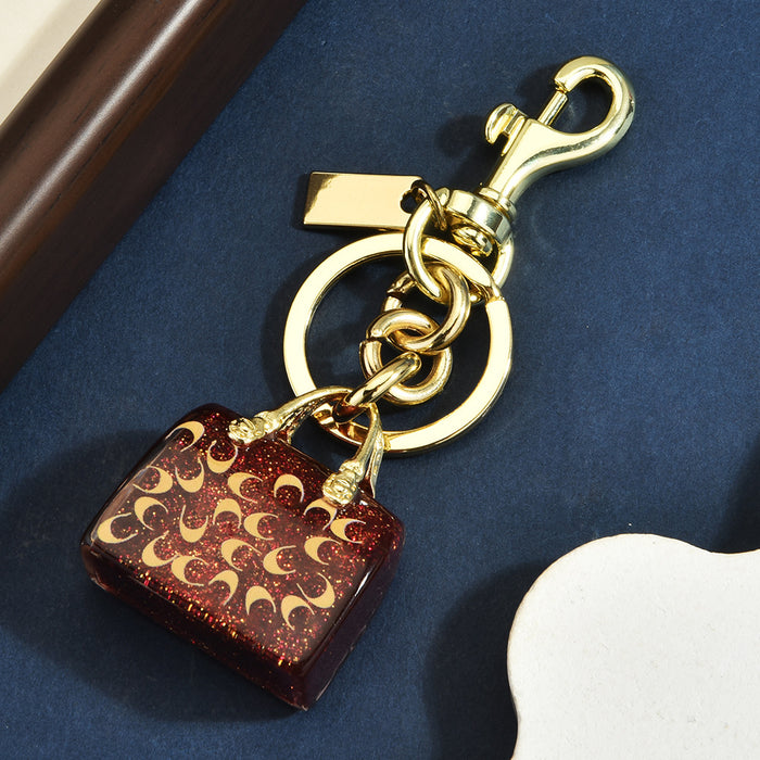 Wholesale Chic Letter C Bag Charm Keychain Red Alloy Electroplated Women S Purse Pendant Gift Resale