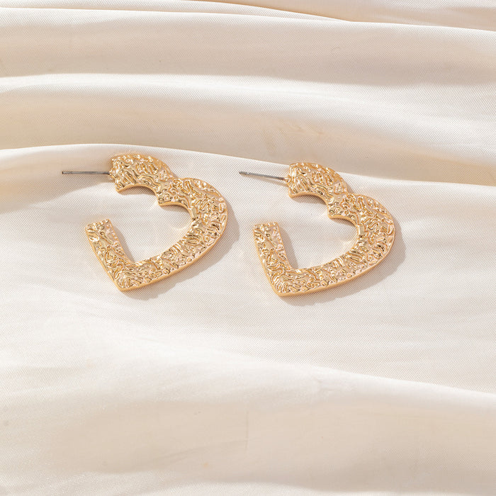 Wholesale Valentine' s Day gold plated embossed hammered texture heart  shaped hollow stud earrings