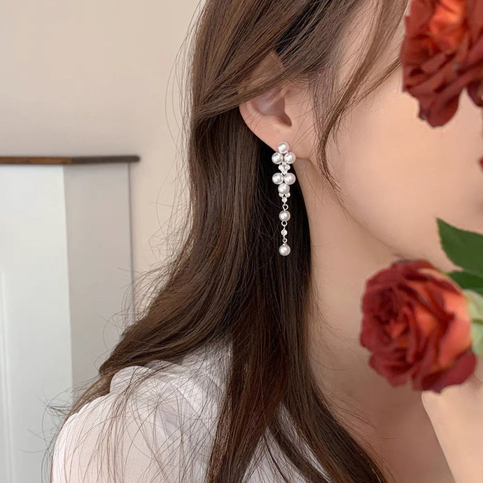 Wholesale Elegant long pearl ear clip without ear hole tassel earrings, fashionable and light luxury