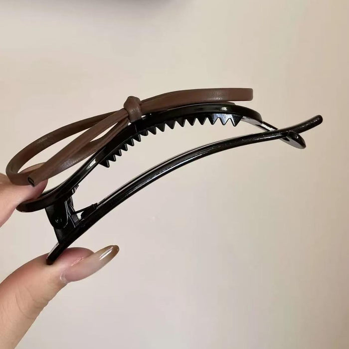 Wholesale Temperament leather bow twist clip hair with a high-end feel, straight clip headband accessory